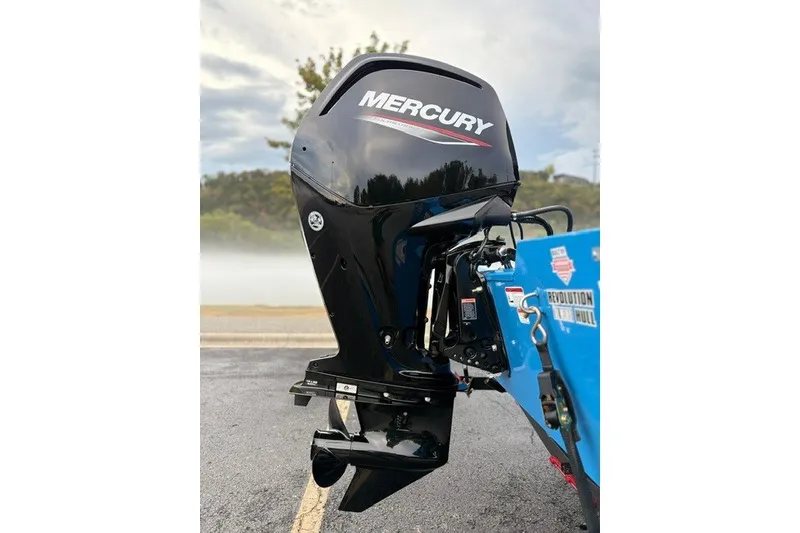Slide: The Image of 2027 Tracker Pro Team 175 Crappie Edition with Mercury outboard motor, parked outdoors. - 17