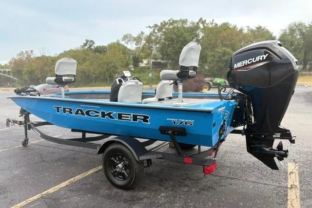 Slide: The Image of 2027 Tracker Pro Team 175 Crappie Edition boat with Mercury engine, parked outdoors. - 13