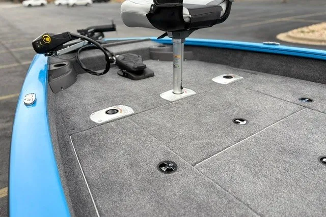 Slide: The Image of 2027 Tracker Pro Team 175 Crappie Edition boat with gray carpeted deck and seating. - 21