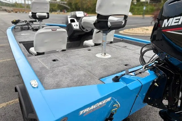 Slide: The Image of 2027 Tracker Pro Team 175 Crappie Edition boat with blue exterior and fishing seats. - 19