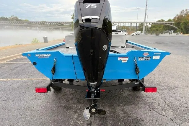 Slide: The Image of 2027 Tracker Pro Team 175 Crappie Edition boat with 75 HP motor, parked on trailer. - 16