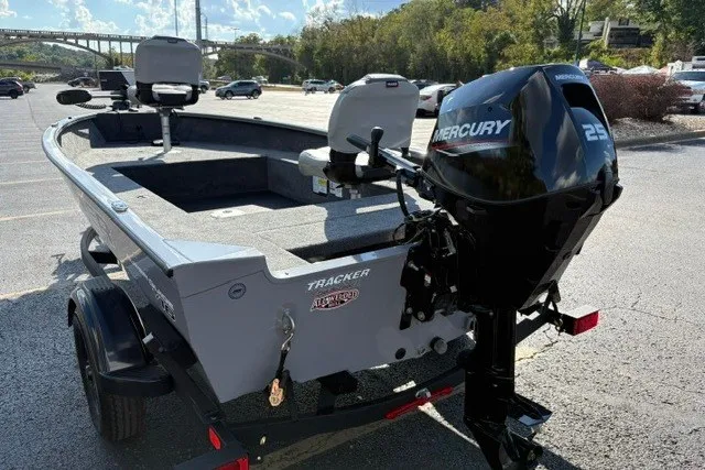 Slide: The Image of 2027 Tracker Super Guide V-16 T boat with Mercury 25 HP engine in parking lot. - 14