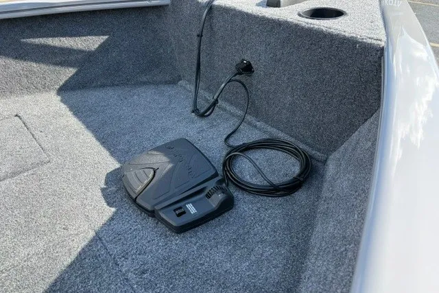 Slide: The Image of Interior of 2027 Tracker Super Guide V-16 T boat with foot pedal and cable. - 20