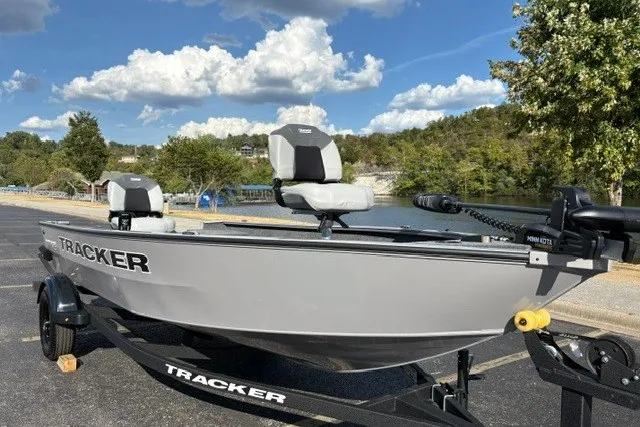 Slide: The Image of 2027 Tracker Super Guide V-16 T boat on trailer by scenic lake. - 26