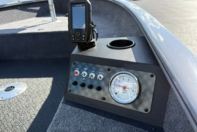 Slide: The Image of Control panel of 2027 Tracker Super Guide V-16 T boat with gauges and GPS device. - 19
