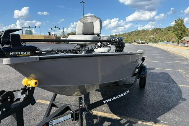 Slide: The Image of 2027 Tracker Super Guide V-16 T boat on trailer in parking lot. - 27