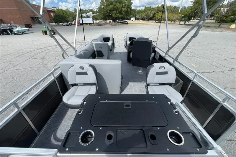 Slide: The Image of 2027 Sun Tracker SportFish 22 DLX pontoon boat with spacious seating and fishing amenities. - 13