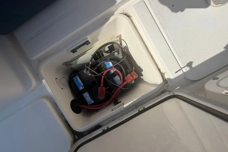 Slide: The Image of Battery compartment of a 2001 Century 2900 Center Console boat with wiring visible. - 48