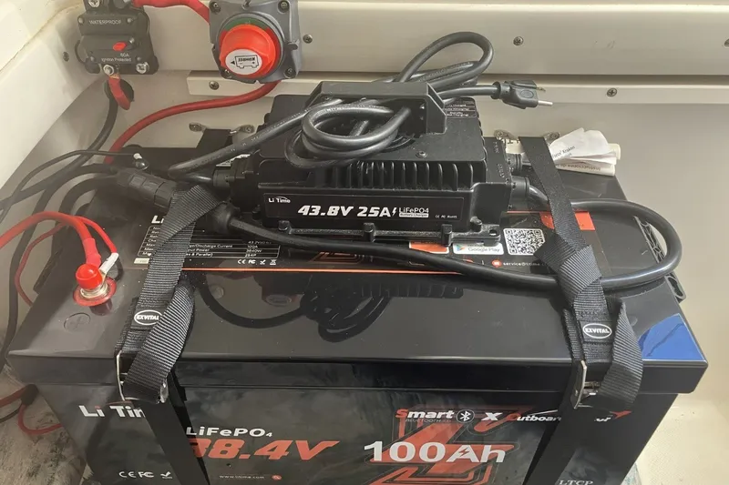 Slide: The Image of Battery setup in a 2001 Century 2900 Center Console boat with LiFePO4 charger. - 51