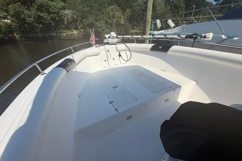 Slide: The Image of 2001 Century 2900 Center Console boat interior with seating and storage compartments. - 50