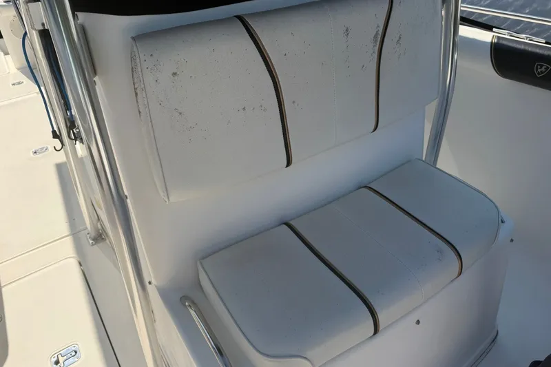 Slide: The Image of White seating on a 2001 Century 2900 Center Console boat, showing slight wear. - 11