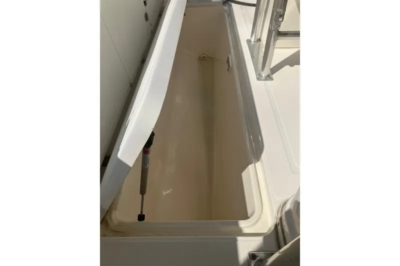 Slide: The Image of Open storage compartment on 2001 Century 2900 Center Console boat. - 57