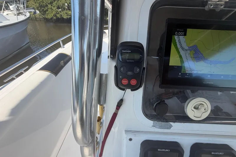 Slide: The Image of Century 2900 Center Console 2001 boat dashboard with Garmin navigation and Raymarine remote. - 27