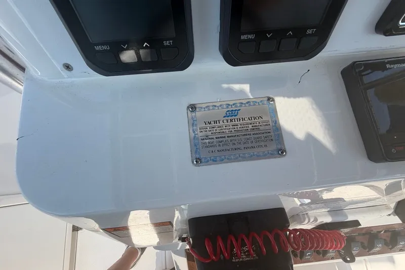 Slide: The Image of Control panel of a 2001 Century 2900 Center Console with yacht certification plaque. - 31