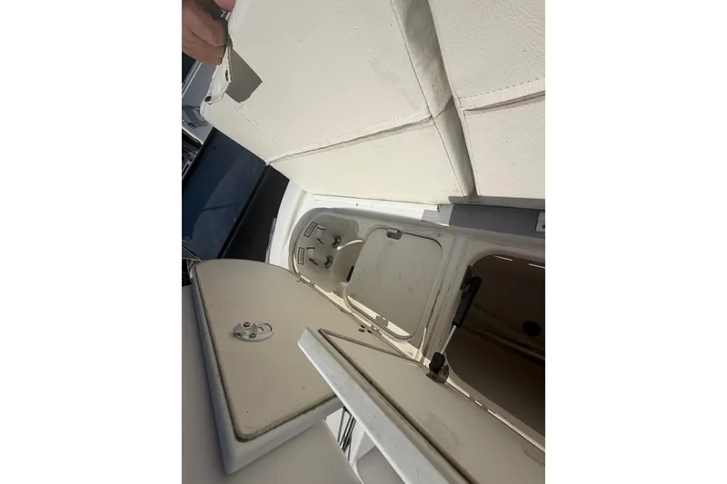 Slide: The Image of Open storage compartments on a 2001 Century 2900 Center Console boat. - 47
