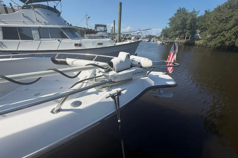 Slide: The Image of Century 2900 Center Console boat with Garmin equipment docked on a sunny day. - 55