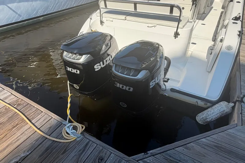 Slide: The Image of Century 2900 Center Console 2001 with twin Suzuki 300 outboard motors docked. - 36