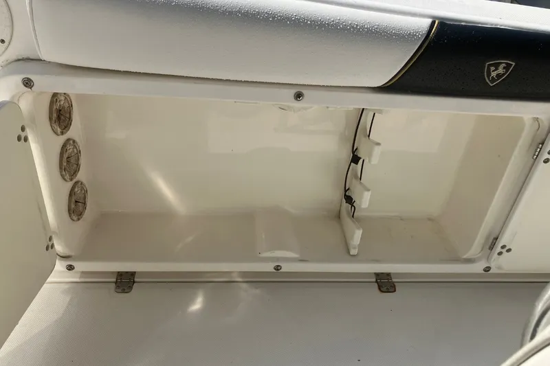 Slide: The Image of Open storage compartment on a 2001 Century 2900 Center Console boat. - 55