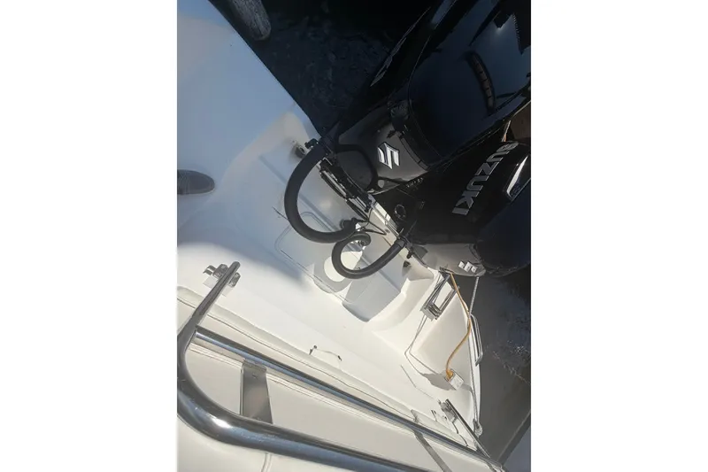 Slide: The Image of 2001 Century 2900 Center Console boat with Suzuki outboard engines, viewed from above. - 43