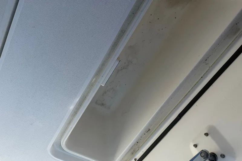 Slide: The Image of Open storage compartment on a 2001 Century 2900 Center Console boat. - 12