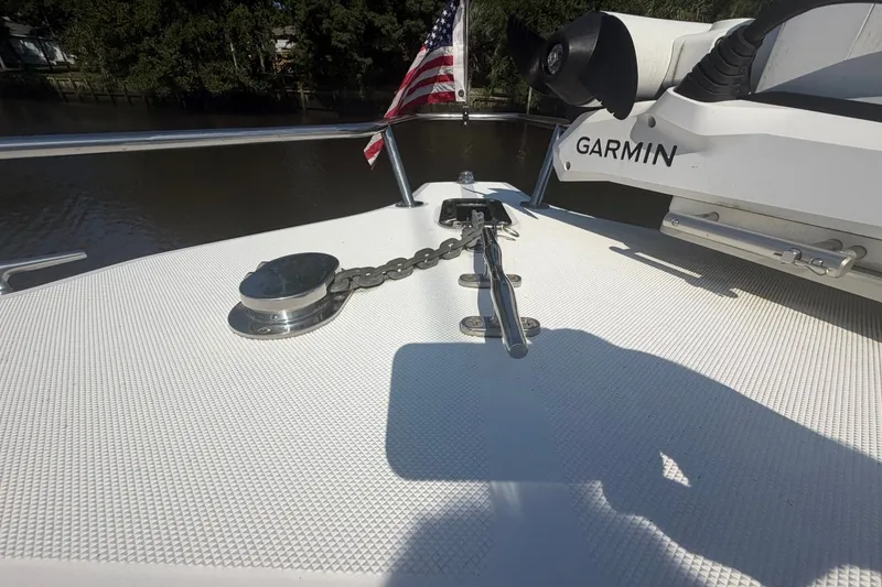 Slide: The Image of Bow of a 2001 Century 2900 Center Console with anchor chain and Garmin equipment. - 51