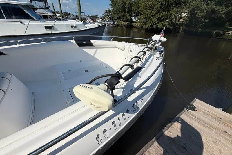 Slide: The Image of 2001 Century 2900 Center Console boat docked, featuring Garmin equipment and sleek design. - 5