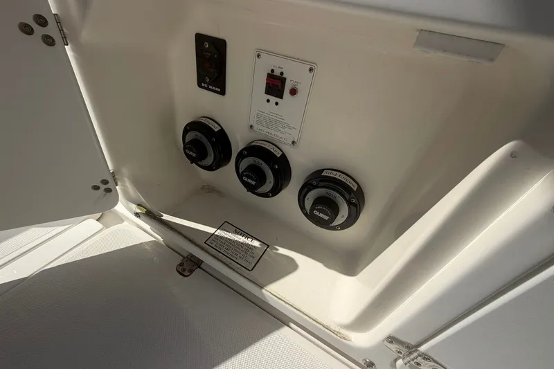 Slide: The Image of Control panel inside a 2001 Century 2900 Center Console boat compartment. - 24