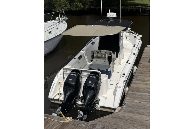Slide: The Image of 2001 Century 2900 Center Console boat docked with dual 300 horsepower engines. - 3