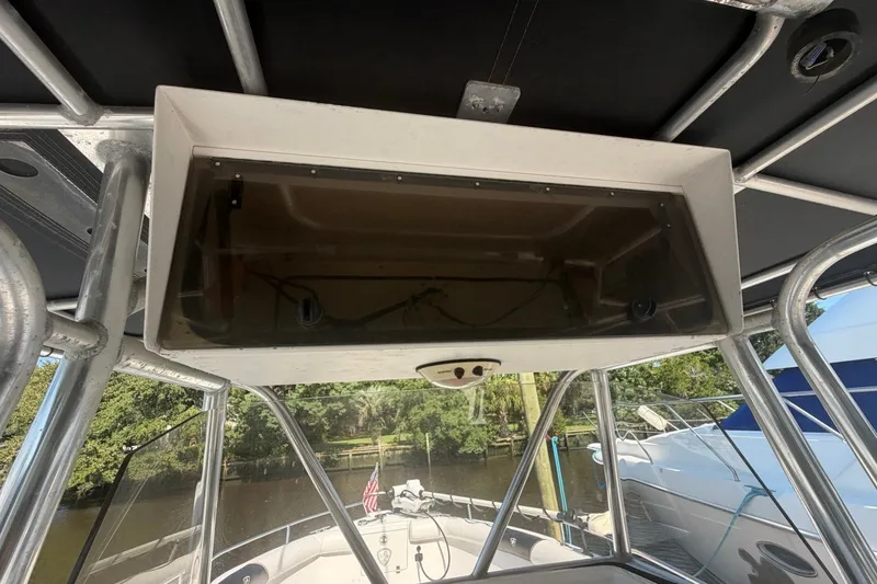 Slide: The Image of 2001 Century 2900 Center Console boat interior with overhead storage compartment. - 20