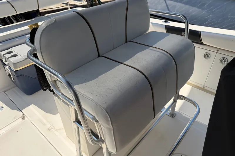 Slide: The Image of Century 2900 Center Console 2001 boat seating with stainless steel frame and cushioned seats. - 17