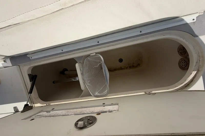 Slide: The Image of Open storage compartment on a 2001 Century 2900 Center Console boat. - 46