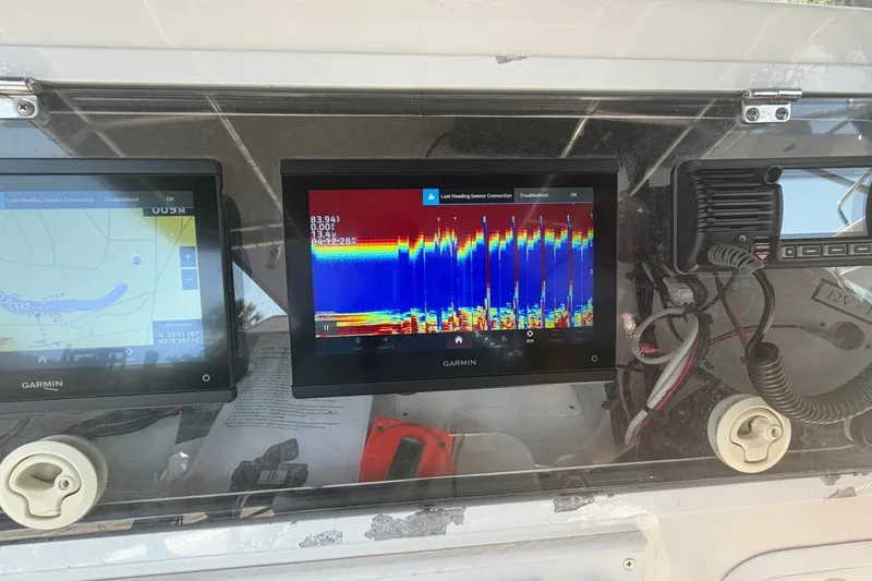 Slide: The Image of Garmin navigation and sonar displays on a 2001 Century 2900 Center Console boat. - 29