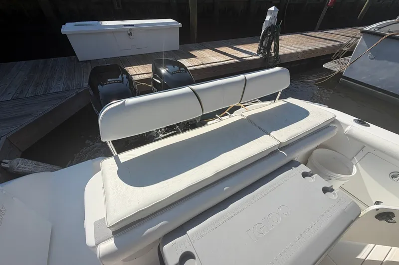 Slide: The Image of 2001 Century 2900 Center Console boat with seating and dual outboard motors. - 44