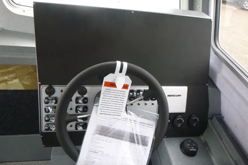 Slide: The Image of Steering wheel and control panel of 2027 KingFisher 2825 Coastal Express boat. - 9