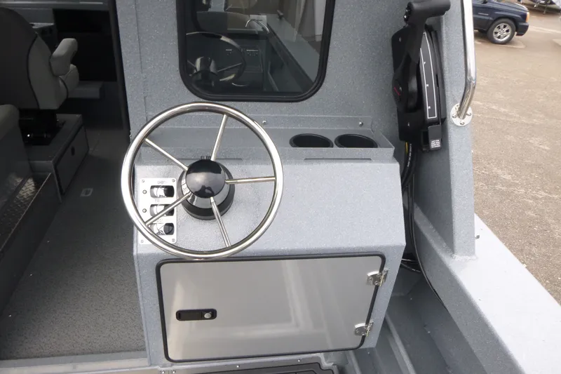 Slide: The Image of Steering console of 2027 KingFisher 2825 Coastal Express boat, featuring modern controls. - 15