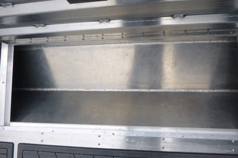 Slide: The Image of Open storage compartment in 2027 KingFisher 2825 Coastal Express boat. - 17