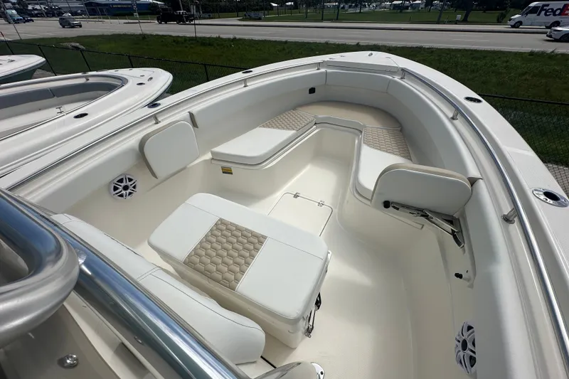 Slide: The Image of 2027 Bulls Bay 255 Center Console boat interior with cushioned seating and modern design. - 8