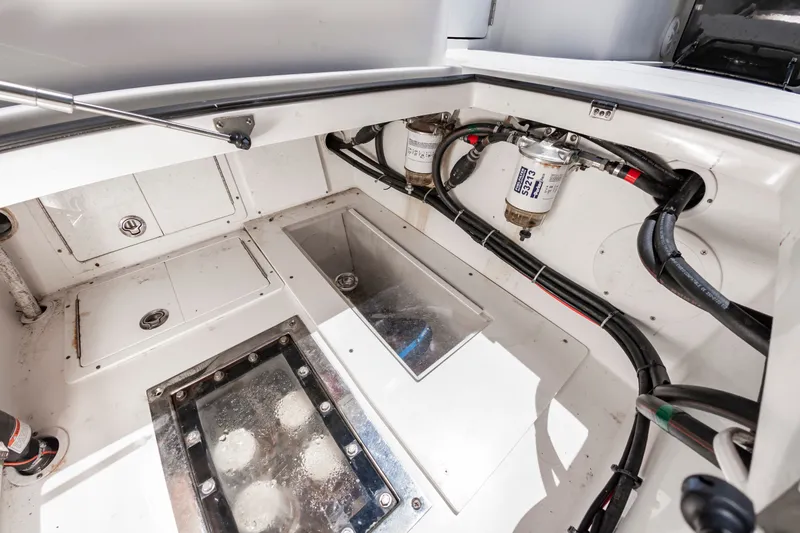 Slide: The Image of A clean, well-organized engine compartment with hoses, filters, and access hatches. - 27