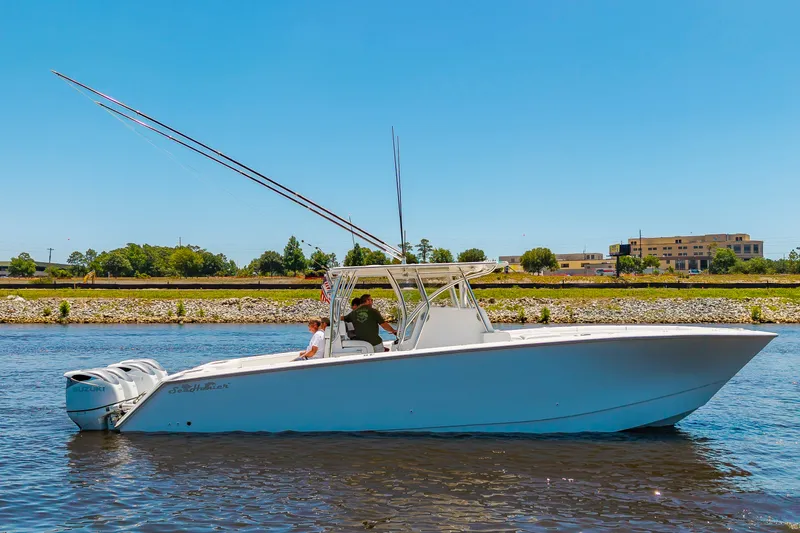 Slide: The Image of A white 2022 SeaHunter 38 CTS boat cruising on calm waters. - 37