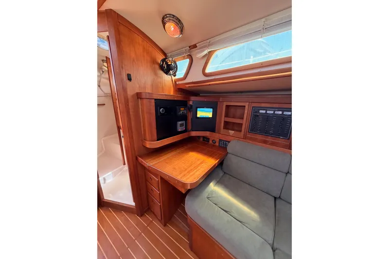 Slide: The Image of Interior of 2002 Sabre 362 sailboat with navigation station and wooden cabinetry. - 67