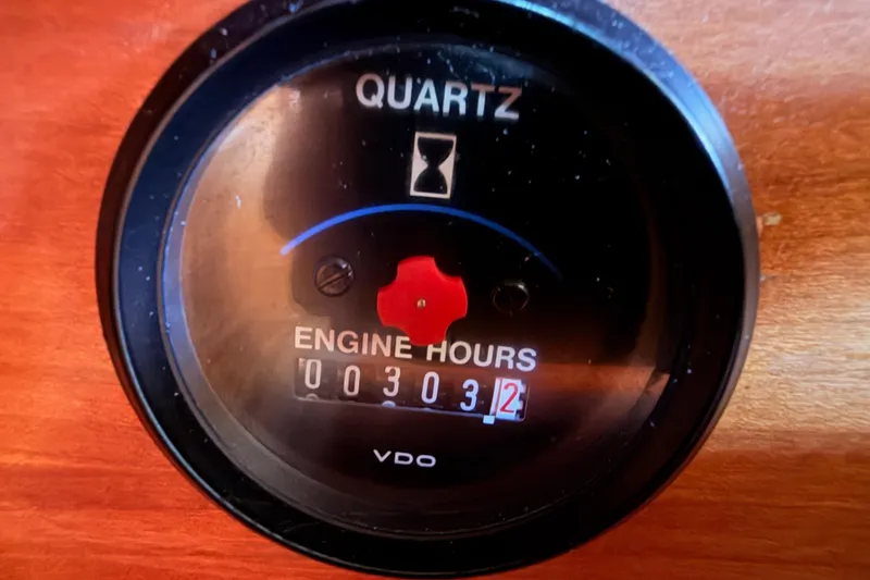 Slide: The Image of Quartz engine hour meter displaying 303.2 hours on a 2002 Sabre 362. - 69
