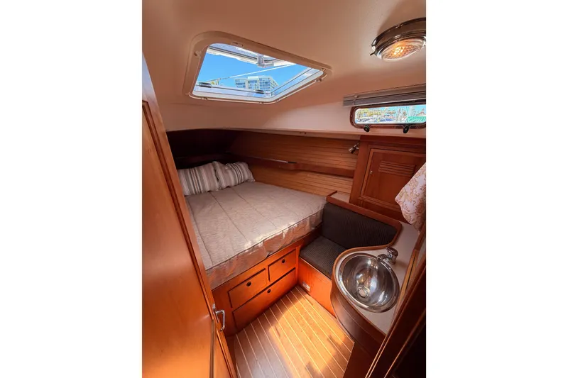 Slide: The Image of Cozy cabin interior of 2002 Sabre 362 sailboat with bed, sink, and skylight. - 79