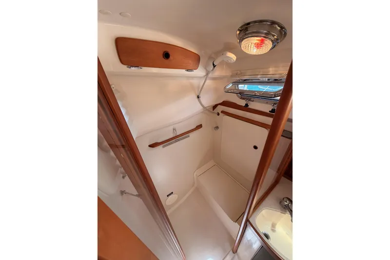 Slide: The Image of 2002 Sabre 362 yacht bathroom with wooden accents and modern fixtures. - 59
