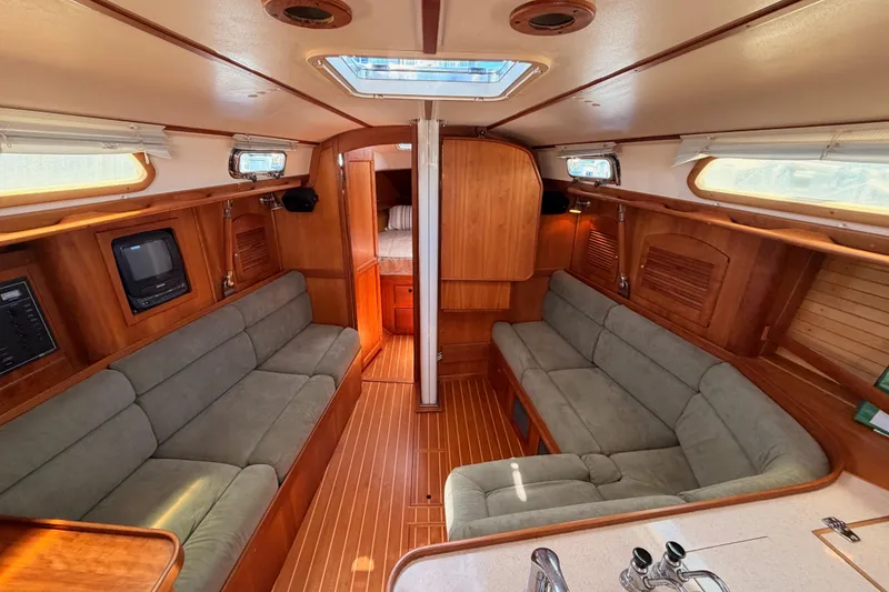 Slide: The Image of Interior of 2002 Sabre 362 sailboat with wood finish and cozy seating. - 62