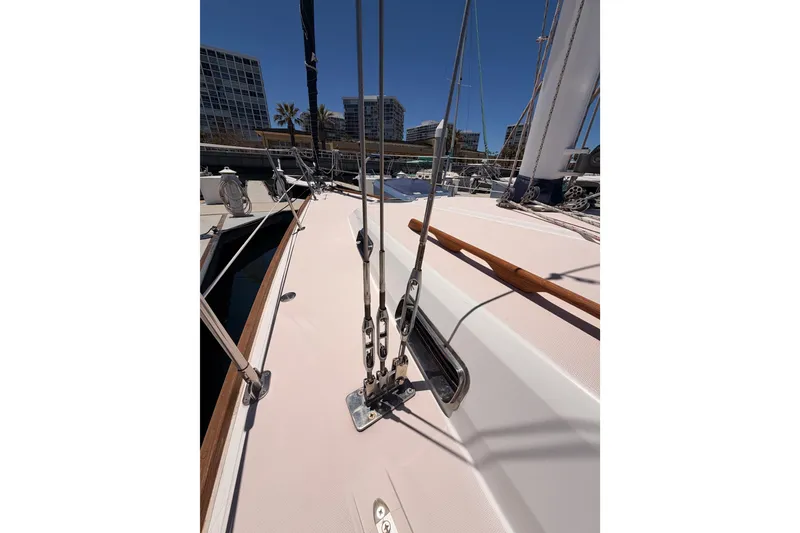 Slide: The Image of Deck view of a 2002 Sabre 362 sailboat in a marina setting. - 16