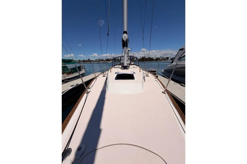 Slide: The Image of 2002 Sabre 362 sailboat deck view, docked in a marina under clear blue skies. - 21