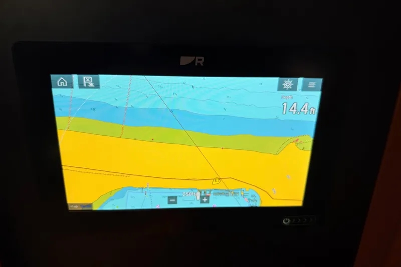 Slide: The Image of Navigation display showing depth of 14.4 feet on a Sabre 362, 2002 model. - 71