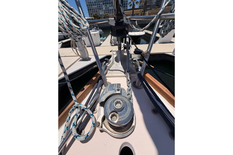 Slide: The Image of Deck view of a 2002 Sabre 362 sailboat, featuring winches and rigging. - 20