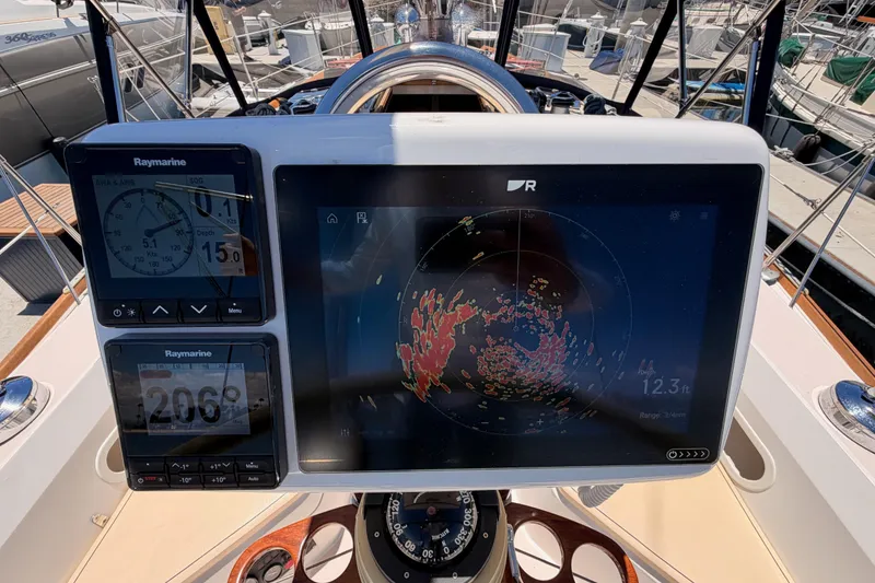 Slide: The Image of Cockpit of 2002 Sabre 362 sailboat with Raymarine navigation displays. - 34