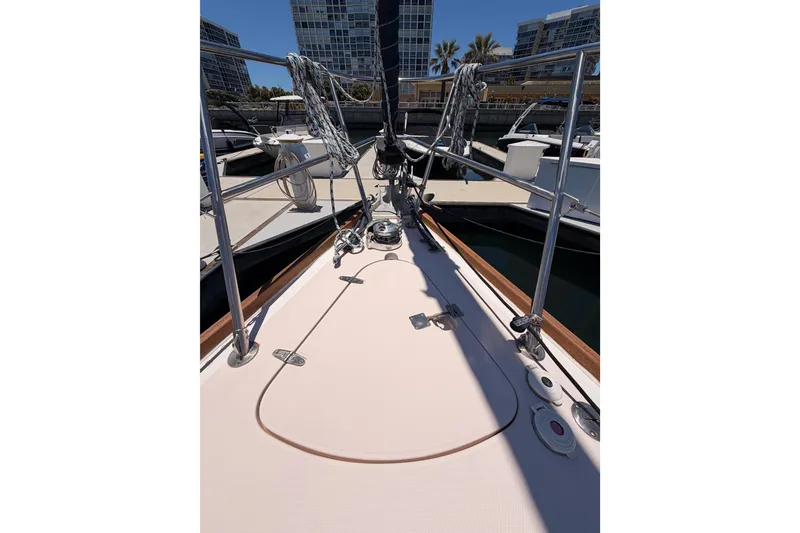 Slide: The Image of Bow view of 2002 Sabre 362 sailboat docked at marina with cityscape background. - 18